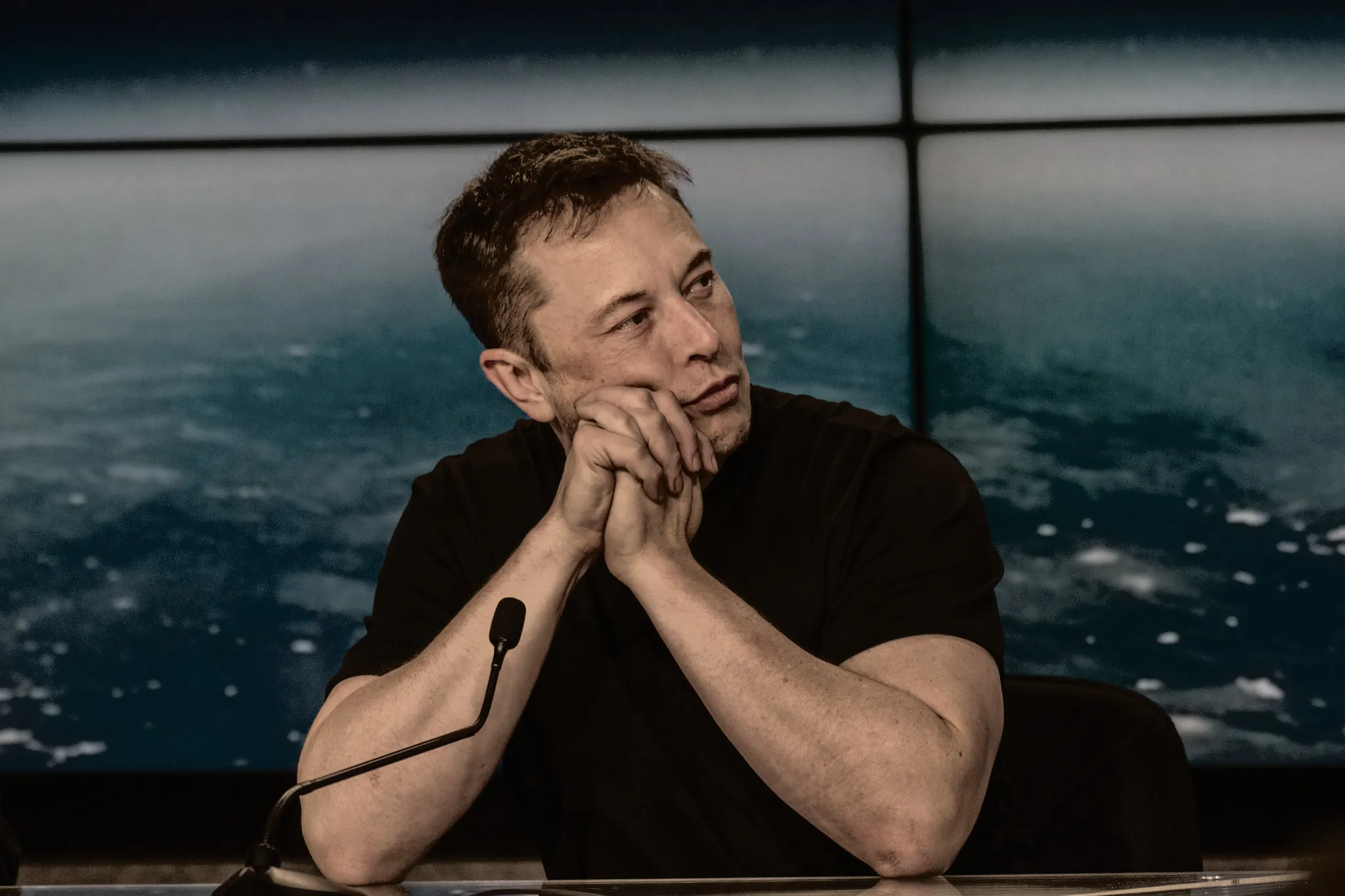 Elon Musk thinking during an interview